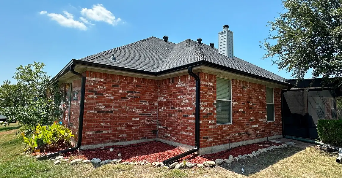 rain gutters dallas tx being installed by the Ripcord Roofing team